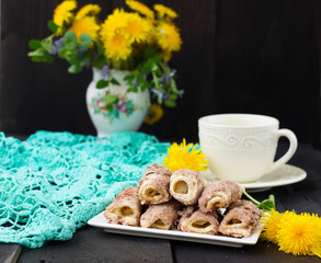 Cookies rolls with rhubarb and cinnamon on a dark background
