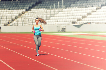 Athlete running on professional track, preparing for marathon