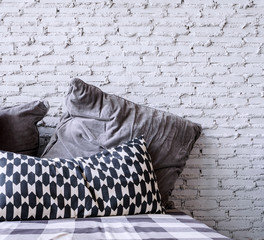 pillows and brick wallpaper - 83619296