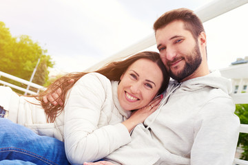 smiley couple in love looking at camera