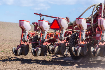 Tractor harrowing the field