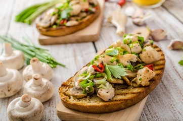Toast with mushrooms and fried chicken, sprinkled with