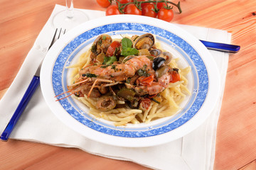Trofie pasta with shellfish mollusks and fish 