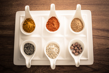 Wooden table of colorful spices