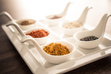 Wooden table of colorful spices
