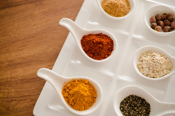 Wooden table of colorful spices