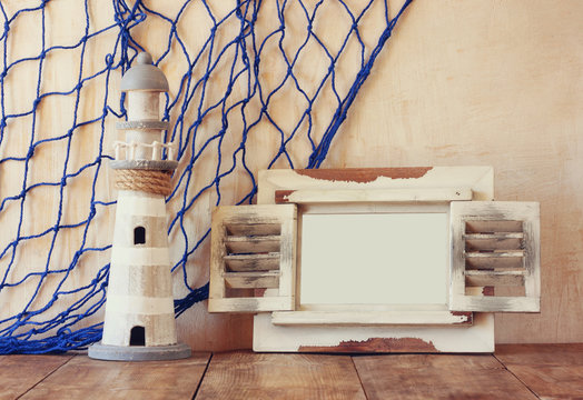 old vintage wooden white frame and lighthouse