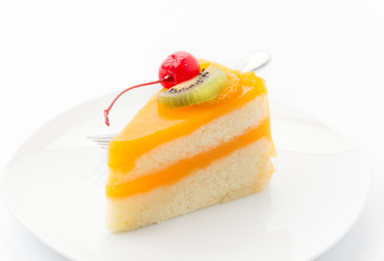 orange cake with kiwi and cherry