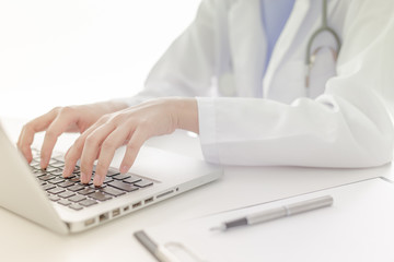 Young and professional doctor working in office