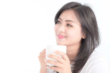 beautiful young woman hold cup of coffee lying think relaxing on