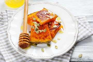 Pumpkin with honey on a plate