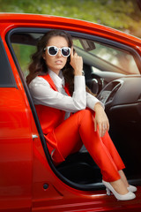 Elegant Beautiful Woman in Red Car