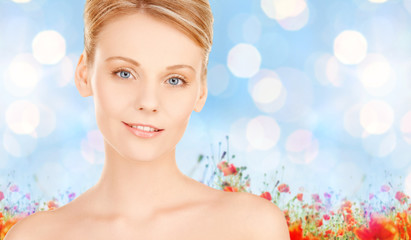 beautiful young woman face over blue background