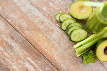 close up of fresh green juice glass and vegetables