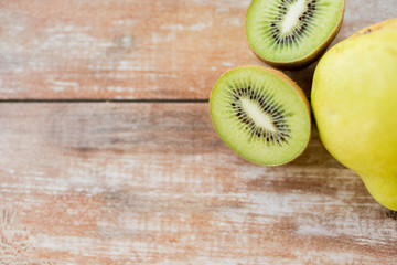 Fototapeta na wymiar close up of ripe kiwi and pear on table