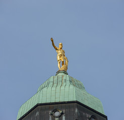 Fototapeta na wymiar Hercules statue on top of Town Hall tower in Dresden.