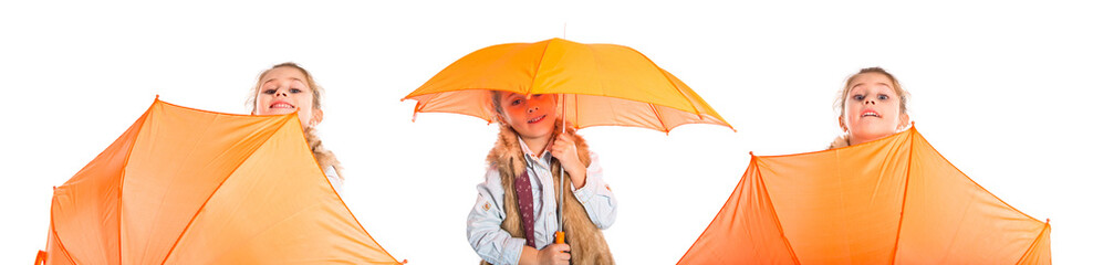 Blonde little girl holding an umbrella