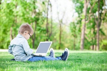 boy with a books and laptop computer