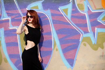 Beautiful redhead women in black dress