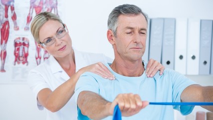 Fototapeta premium Doctor examining her patient back 
