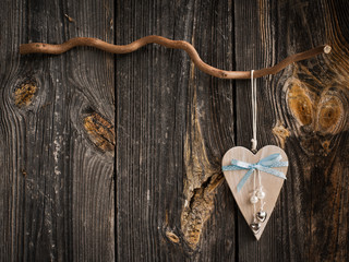 wooden heart hanging on a branch