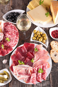 composition with meat, heese and wineglass