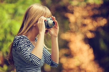 Woman photographing in nature.