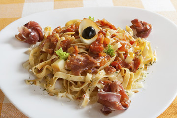 Tagliatelle with Napoliten sauce, smoked ham and cheese.