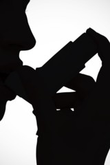 Composite image of blonde woman taking her inhaler