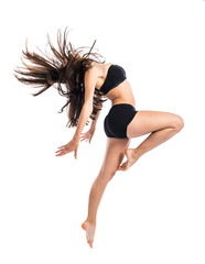 Naklejka premium Young fitness female jumping