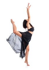 Young ballet dancer posing over white background