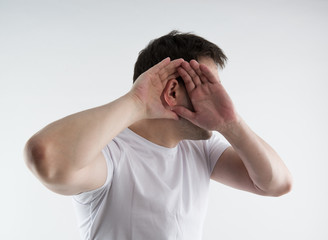Fototapeta premium Young man having hearing problem. Ear pain and disease. 