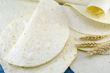 Fresh tortillas and a stick of wheat