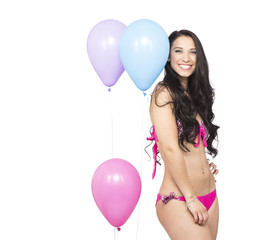 Attractive Young Smiling Brunette holding Colorful Balloons - 83643049