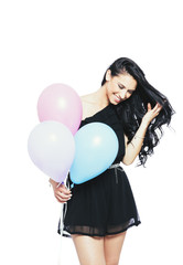 Attractive Young Smiling Brunette holding Colorful Balloons - 83643234