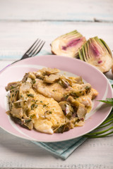 fillet fish with sauteed artichoke, selective focus