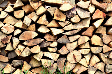 stack of wood firewood in background