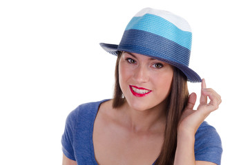 Portrait of young woman with blue hat