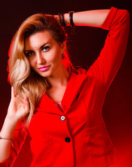 Fototapeta premium Beautiful woman in bright red lights
