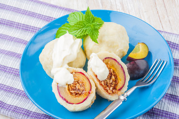Sweet plum dumplings with sweet cream