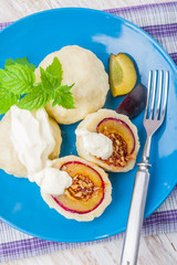 Sweet plum dumplings with sweet cream