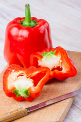 Sliced red pepper on wooden board