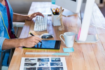 Businessman working with digitizer at his desk