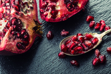 Pieces and grains of ripe pomegranate. Pomegranate seeds. 