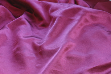 background texture of shiny red silk