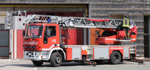 red truck with metal scale of firefighters in the Firehouse