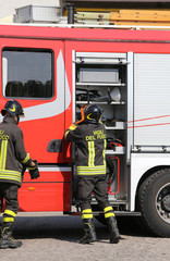 italian firefighters during an emergency with  helmets