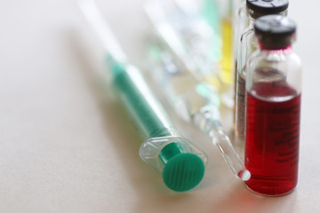 background medicine pill vials syringes