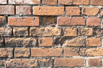 Closeup of broken bricks of a vintage wall