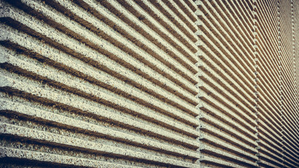 Striped concrete wall of a bridge